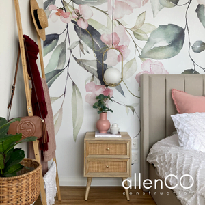 Bedroom with floral wallpaper, gold pendant light and timber side table