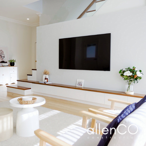 White family room with wall mounted TV and a timber staircase