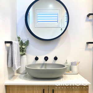 Ensuite bathroom with timber vanity, stone sink and black bathroom accessories