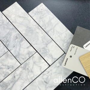 Close up of marble herringbone tile and Laminex colour selections for laundry renovation