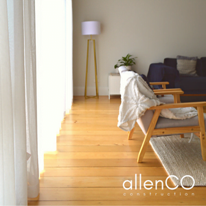 Modern arm chairs in a family room. There are polished floorboards