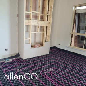 Remodelling of a fireplace and installation of hydronic underfloor heating pipes