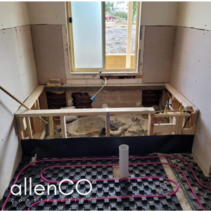 Demolition of bath and hydronic underfloor heating in a bathroom