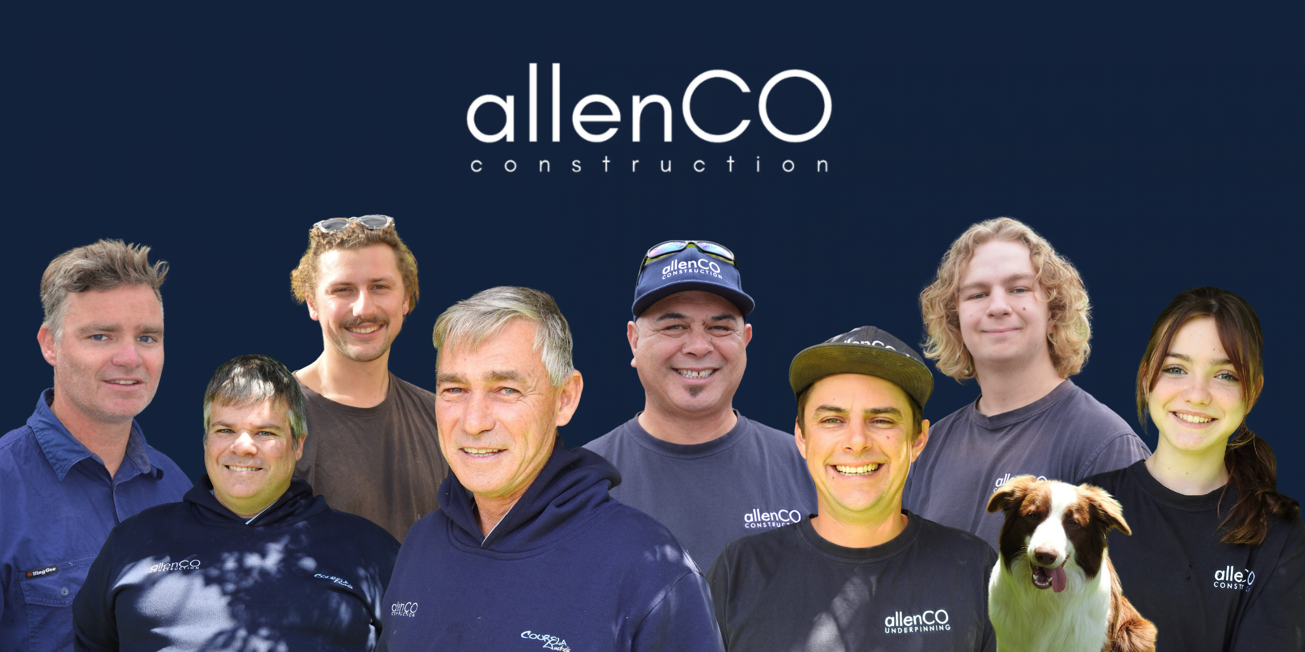 Group photo of the allenco construction team with company logo. There are 8 people and 1 dog