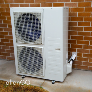 External air conditioner unit of a home.